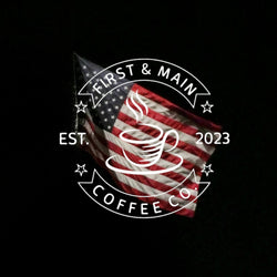 An American Flag in a black background with a white logo of First And Main Coffee Company.